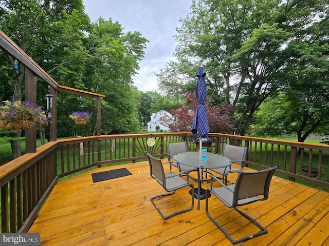 5441 Gladewright Dr, Centreville, VA 20120 - wooden deck featuring outdoor dining space and view of scattered trees