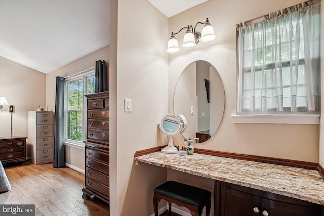 5441 Gladewright Dr, Centreville, VA 20120 - bathroom featuring wood finished floors, lofted ceiling, vanity, and baseboards