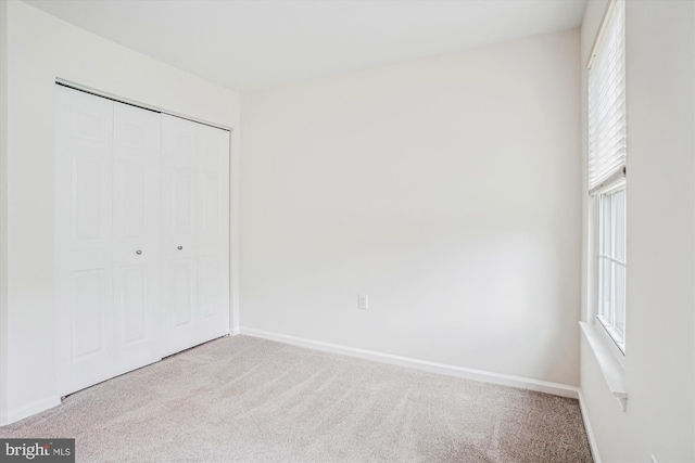 5441 Gladewright Dr, Centreville, VA 20120 - unfurnished bedroom featuring carpet floors, a closet, and multiple windows