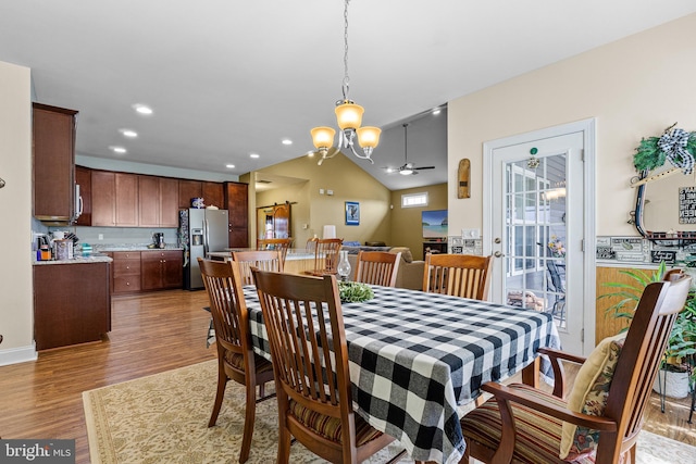 20843 Country Rd, Georgetown, DE 19947 - dining area featuring light wood-style flooring, a chandelier, a ceiling fan, vaulted ceiling, and recessed lighting