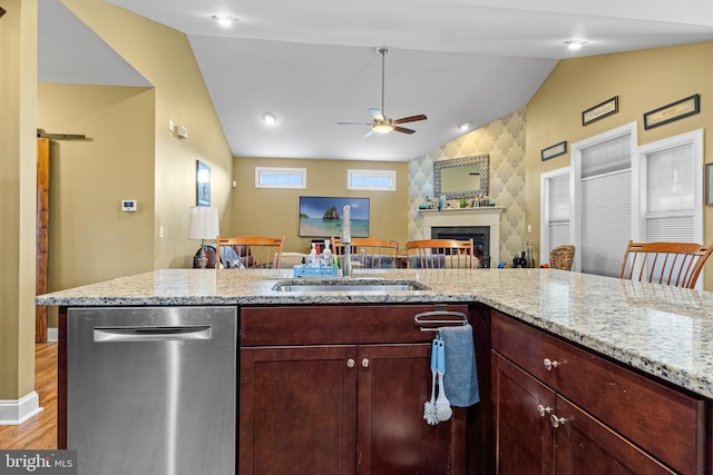 20843 Country Rd, Georgetown, DE 19947 - kitchen featuring stainless steel dishwasher, vaulted ceiling, a ceiling fan, a sink, and open floor plan