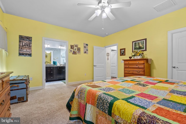 20843 Country Rd, Georgetown, DE 19947 - bedroom featuring light colored carpet, baseboards, ensuite bath, and a ceiling fan