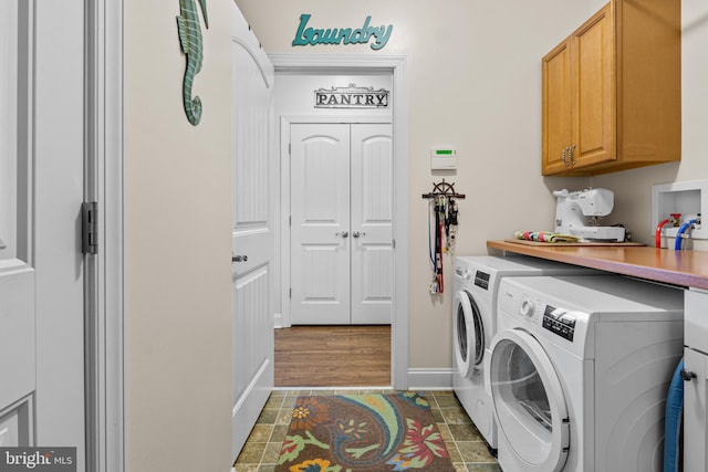 20843 Country Rd, Georgetown, DE 19947 - washroom featuring independent washer and dryer, cabinet space, baseboards, and tile patterned floors