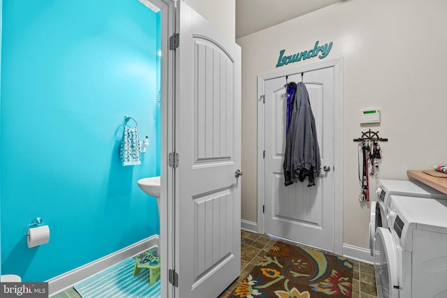 20843 Country Rd, Georgetown, DE 19947 - bathroom with washing machine and dryer and baseboards