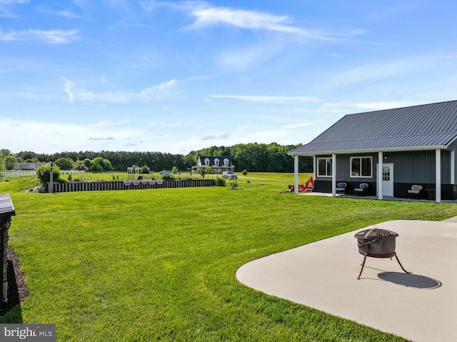 20843 Country Rd, Georgetown, DE 19947 - view of green lawn featuring a fire pit and a patio area