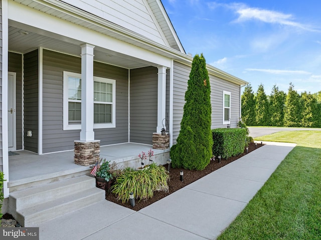 20843 Country Rd, Georgetown, DE 19947 - entrance to property featuring covered porch and a lawn