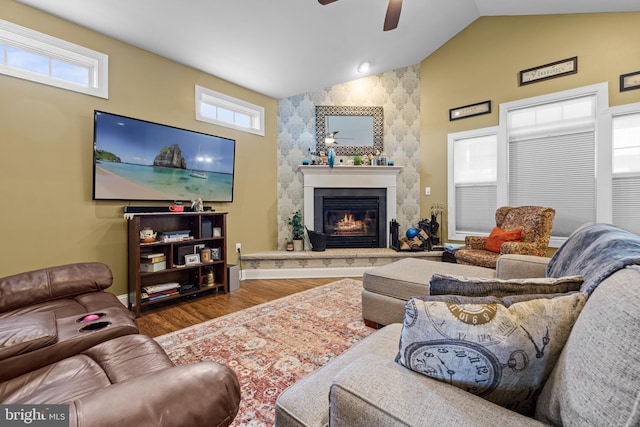 20843 Country Rd, Georgetown, DE 19947 - living room with a ceiling fan, a stone fireplace, wood finished floors, high vaulted ceiling, and baseboards