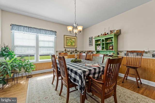 20843 Country Rd, Georgetown, DE 19947 - dining space with a chandelier, light wood-type flooring, and baseboards