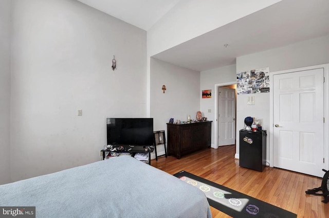 1316 Irving St NW, Washington, DC 20010 - bedroom with light wood-style flooring and vaulted ceiling