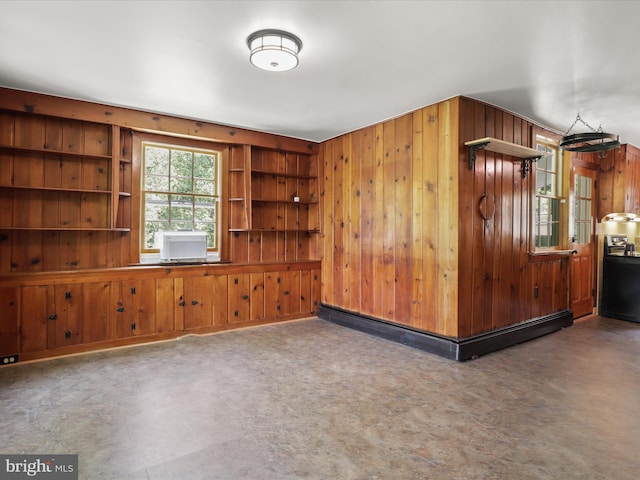 8301 Crestridge Rd, Fairfax Station, VA 22039 - unfurnished room featuring baseboard heating, wooden walls, and cooling unit