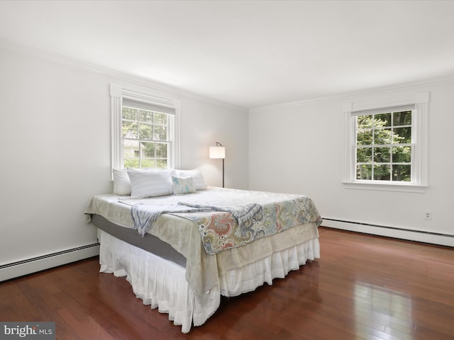 8301 Crestridge Rd, Fairfax Station, VA 22039 - bedroom featuring a baseboard heating unit, ornamental molding, and hardwood / wood-style flooring