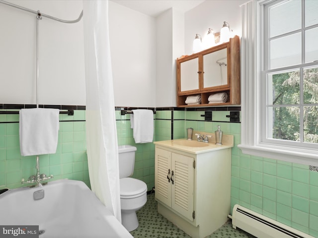8301 Crestridge Rd, Fairfax Station, VA 22039 - full bathroom with a baseboard radiator, tile walls, vanity, and a wainscoted wall