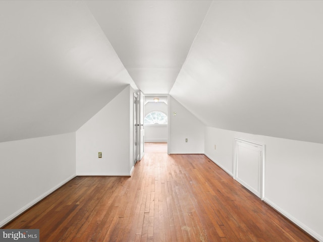 8301 Crestridge Rd, Fairfax Station, VA 22039 - additional living space featuring wood-type flooring and vaulted ceiling