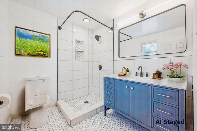 7715 Doe Ln, Glenside, PA 19038 - bathroom featuring a tile shower, vanity, toilet, and tile patterned flooring