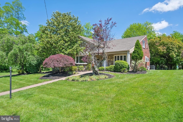 7715 Doe Ln, Glenside, PA 19038 - view of front of property featuring a front lawn, stone siding, and central AC unit