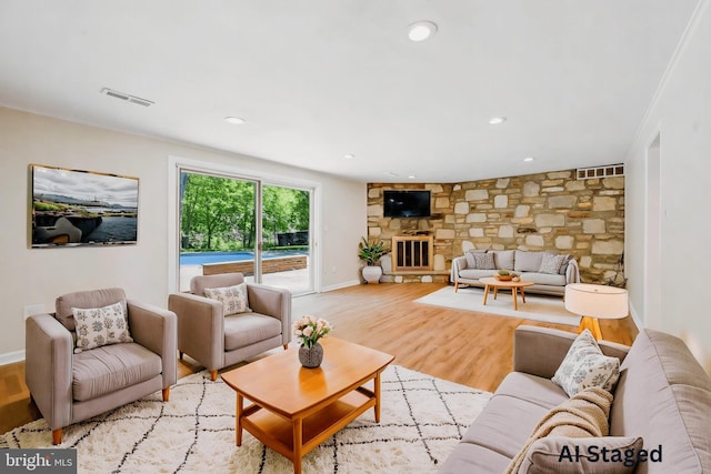 7715 Doe Ln, Glenside, PA 19038 - living area with light wood finished floors, a fireplace, baseboards, and recessed lighting
