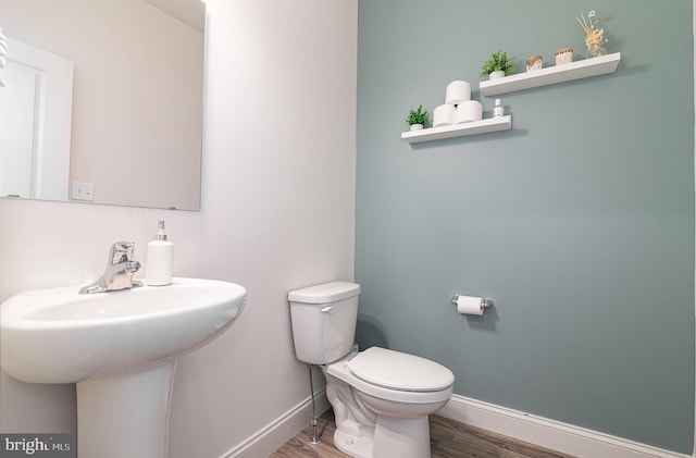 6320 Neha Dr, Mechanicsburg, PA 17050 - half bath featuring wood finished floors, baseboards, and toilet