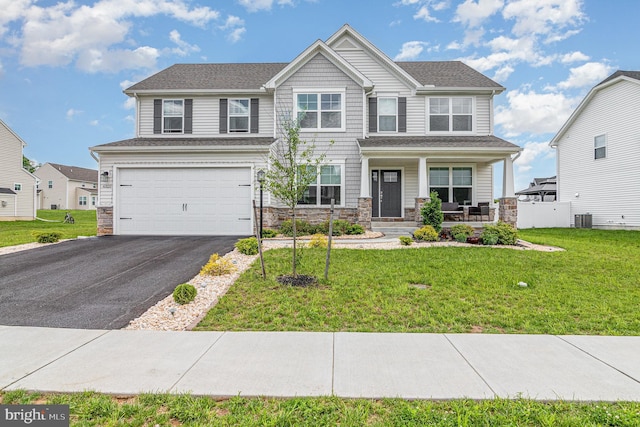 6320 Neha Dr, Mechanicsburg, PA 17050 - view of front of property featuring stone siding, a garage, a porch, driveway, and central AC unit