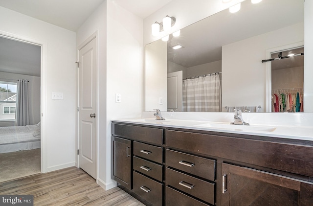 6320 Neha Dr, Mechanicsburg, PA 17050 - full bath with double vanity, wood finished floors, and baseboards