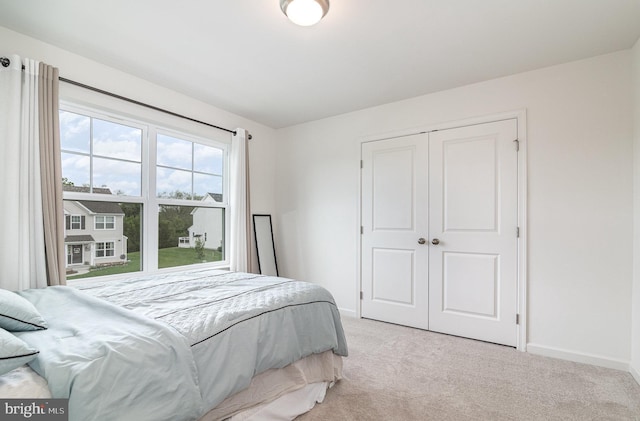 6320 Neha Dr, Mechanicsburg, PA 17050 - bedroom featuring light carpet, baseboards, and a closet