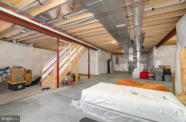 6320 Neha Dr, Mechanicsburg, PA 17050 - unfinished below grade area featuring water heater, electric panel, and stairs
