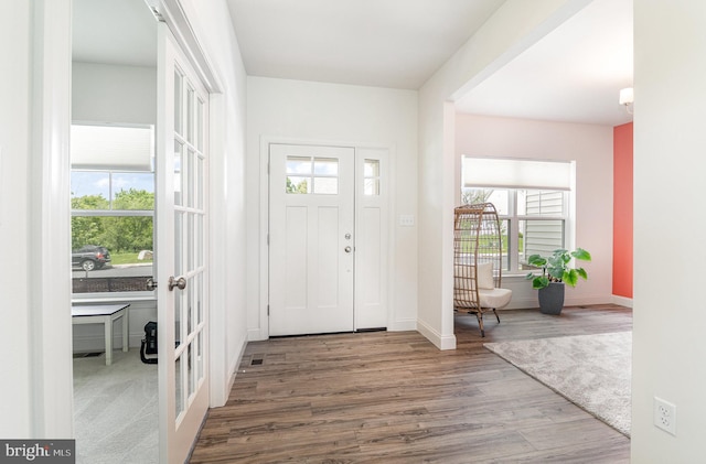 6320 Neha Dr, Mechanicsburg, PA 17050 - foyer with french doors, wood finished floors, plenty of natural light, and baseboards