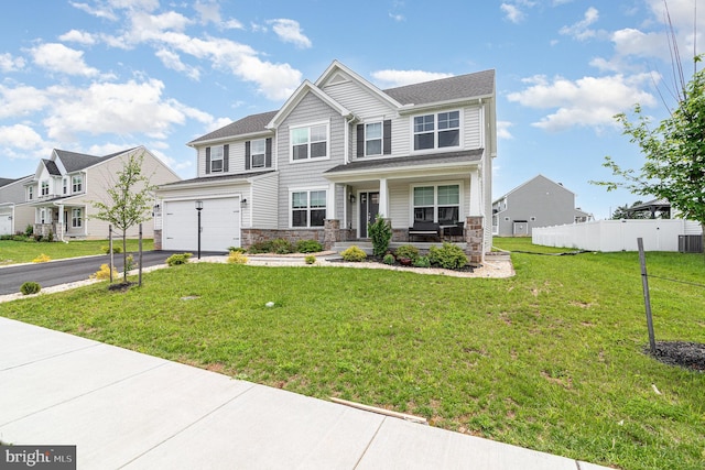 6320 Neha Dr, Mechanicsburg, PA 17050 - view of front of home with covered porch, stone siding, asphalt driveway, and a garage