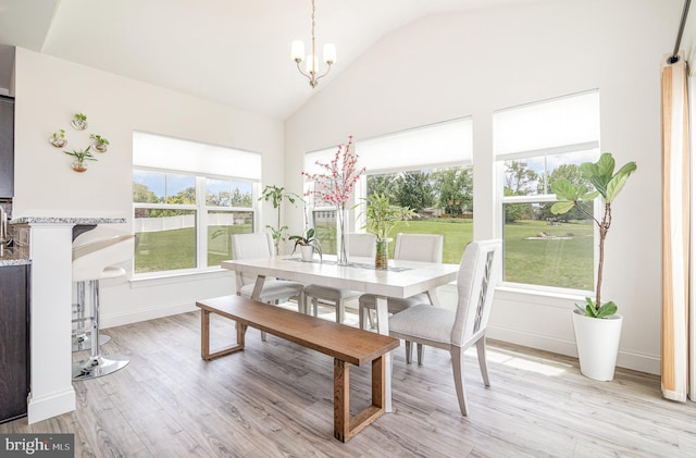 6320 Neha Dr, Mechanicsburg, PA 17050 - dining room featuring a chandelier, light wood-style flooring, baseboards, and high vaulted ceiling