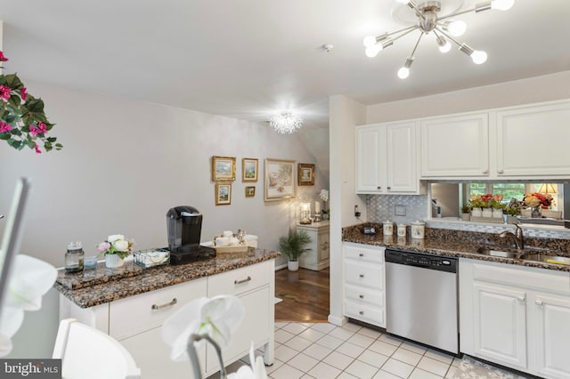 3214 Charing Cross Unit 18, Wilmington, DE 19808 - kitchen with stainless steel dishwasher, a sink, white cabinets, and light tile patterned flooring