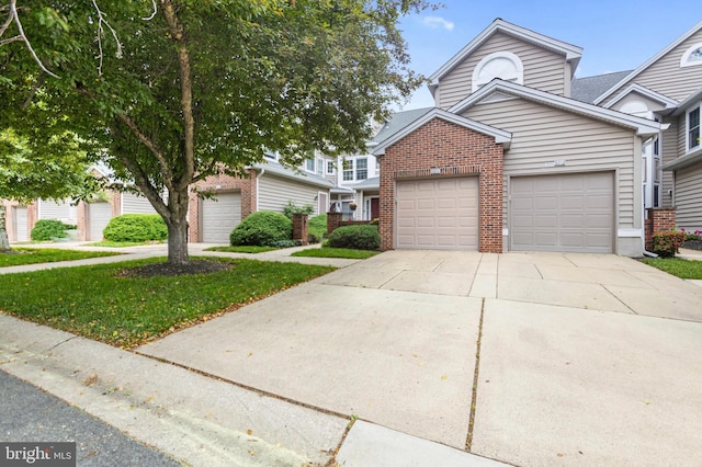 3214 Charing Cross Unit 18, Wilmington, DE 19808 - view of front facade featuring brick siding, concrete driveway, and a garage