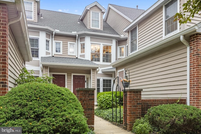3214 Charing Cross Unit 18, Wilmington, DE 19808 - doorway to property featuring a shingled roof and brick siding