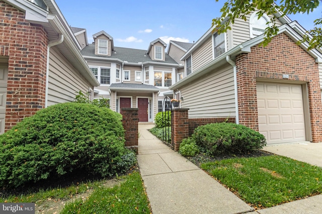 3214 Charing Cross Unit 18, Wilmington, DE 19808 - doorway to property featuring brick siding, concrete driveway, and an attached garage
