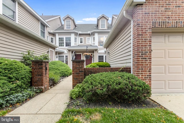 3214 Charing Cross Unit 18, Wilmington, DE 19808 - view of exterior entry with brick siding and a garage