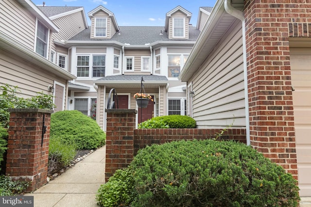 3214 Charing Cross Unit 18, Wilmington, DE 19808 - doorway to property featuring a garage and roof with shingles