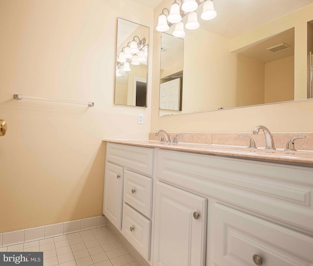 1 Lough Mask Ct Unit 101, Lutherville Timonium, MD 21093 - bathroom with tile patterned flooring, double vanity, baseboards, and a chandelier