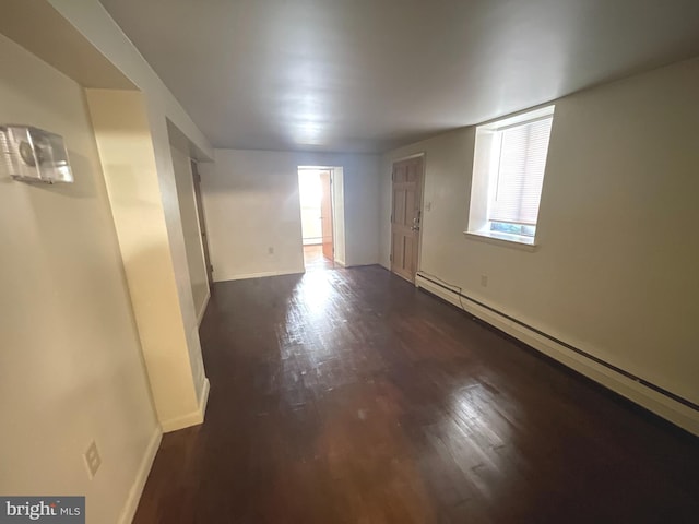 711 Oak Hill Ave, Hagerstown, MD 21740 - spare room with a baseboard radiator, dark wood-style floors, and baseboards