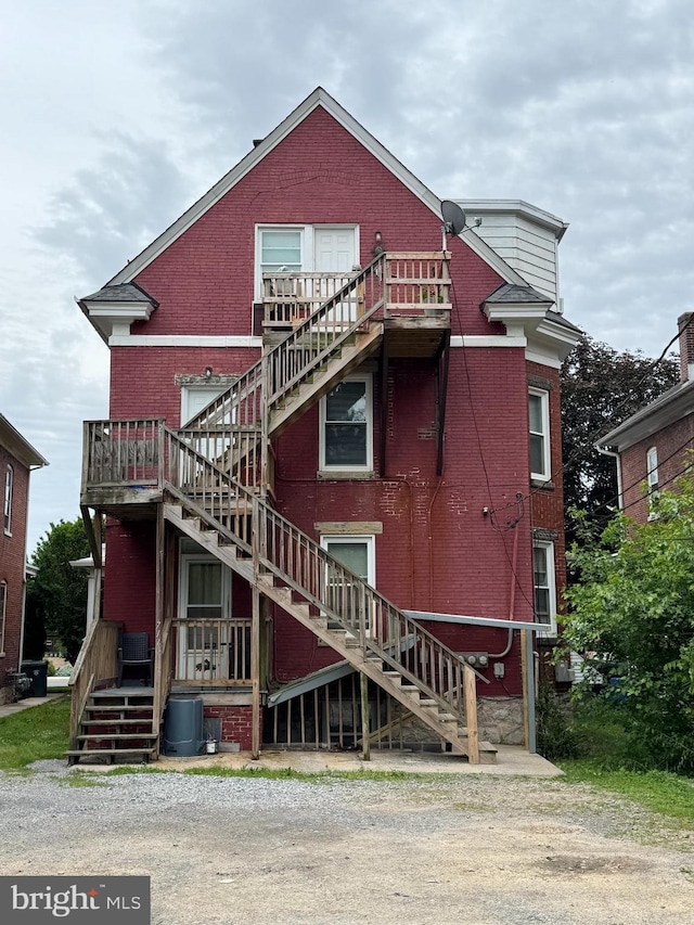 711 Oak Hill Ave, Hagerstown, MD 21740 - view of front of home featuring stairs, brick siding, and a deck