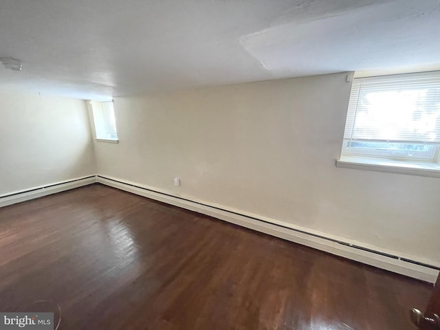 711 Oak Hill Ave, Hagerstown, MD 21740 - basement with dark wood-type flooring and a baseboard radiator