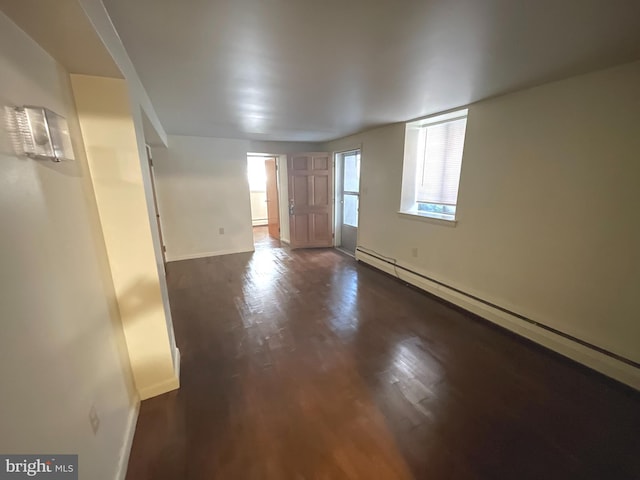 711 Oak Hill Ave, Hagerstown, MD 21740 - empty room with baseboard heating, baseboards, and dark wood finished floors