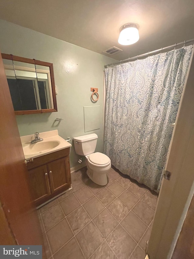 711 Oak Hill Ave, Hagerstown, MD 21740 - bathroom with toilet, vanity, tile patterned flooring, and a shower with curtain