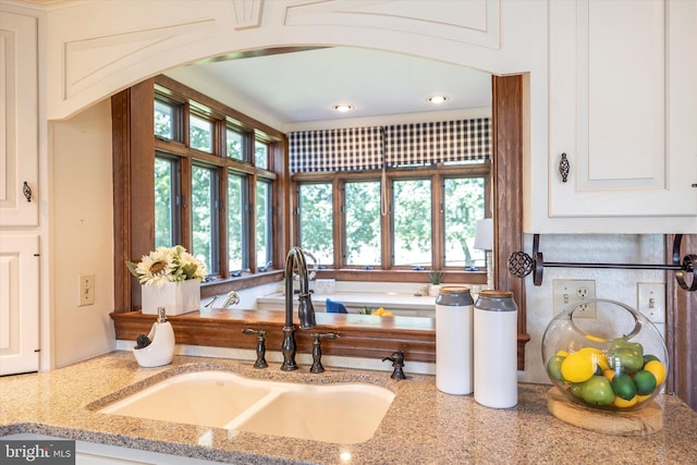 8423 Yellow Springs Rd, Frederick, MD 21702 - kitchen with a sink, arched walkways, light stone counters, white cabinetry, and recessed lighting