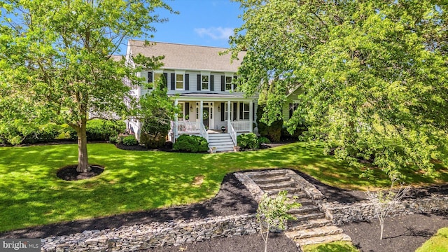 8423 Yellow Springs Rd, Frederick, MD 21702 - colonial home with a porch, a front lawn, and roof with shingles