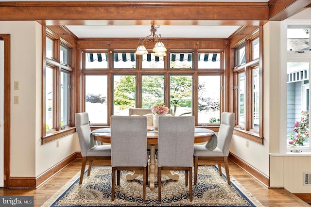 8423 Yellow Springs Rd, Frederick, MD 21702 - dining room featuring baseboards, light wood-type flooring, and a chandelier