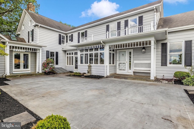 8423 Yellow Springs Rd, Frederick, MD 21702 - back of property with a balcony, french doors, a chimney, and roof with shingles