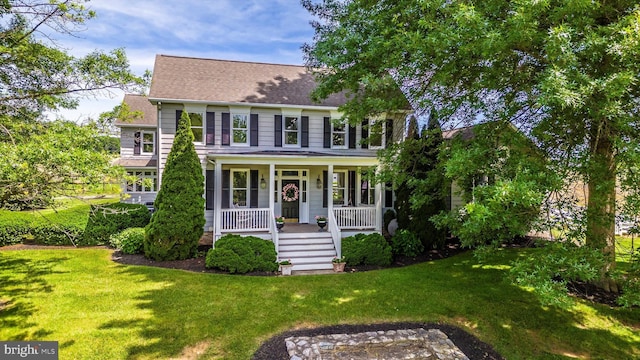 8423 Yellow Springs Rd, Frederick, MD 21702 - colonial home featuring covered porch, a front lawn, and roof with shingles
