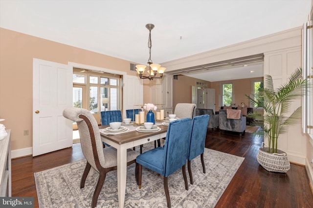8423 Yellow Springs Rd, Frederick, MD 21702 - dining room with a chandelier, dark wood-type flooring, and baseboards