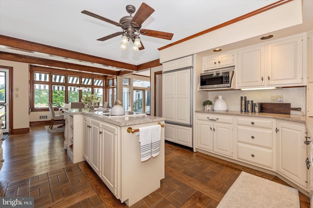 8423 Yellow Springs Rd, Frederick, MD 21702 - kitchen with stainless steel microwave, a kitchen island, white cabinets, and electric stovetop