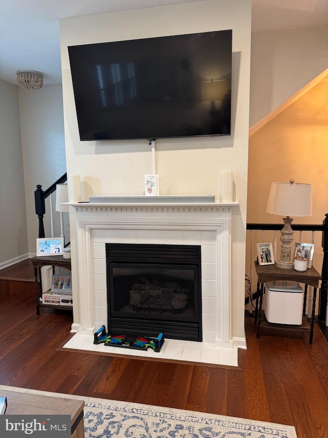 513 Ensemble Ct Unit 513, Hunt Valley, MD 21030 - detailed view of wood finished floors, a tile fireplace, and baseboards
