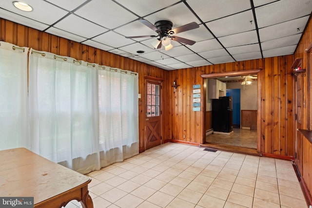 201 Village Rd, Harrisburg, PA 17112 - empty room featuring a ceiling fan, wooden walls, light tile patterned flooring, and baseboards
