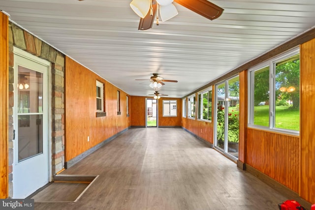 201 Village Rd, Harrisburg, PA 17112 - unfurnished sunroom featuring wood walls, wood finished floors, and baseboards